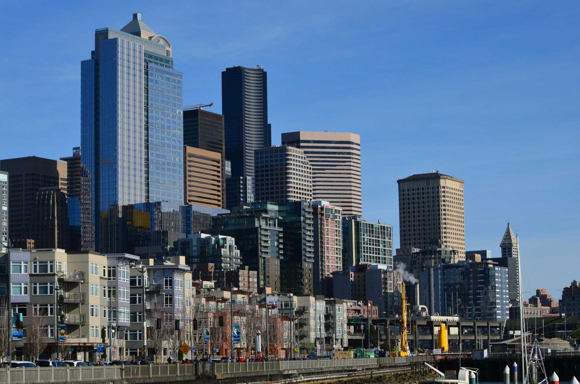 Downtown Seattle office towers rising above the waterfront on a clear sunny day