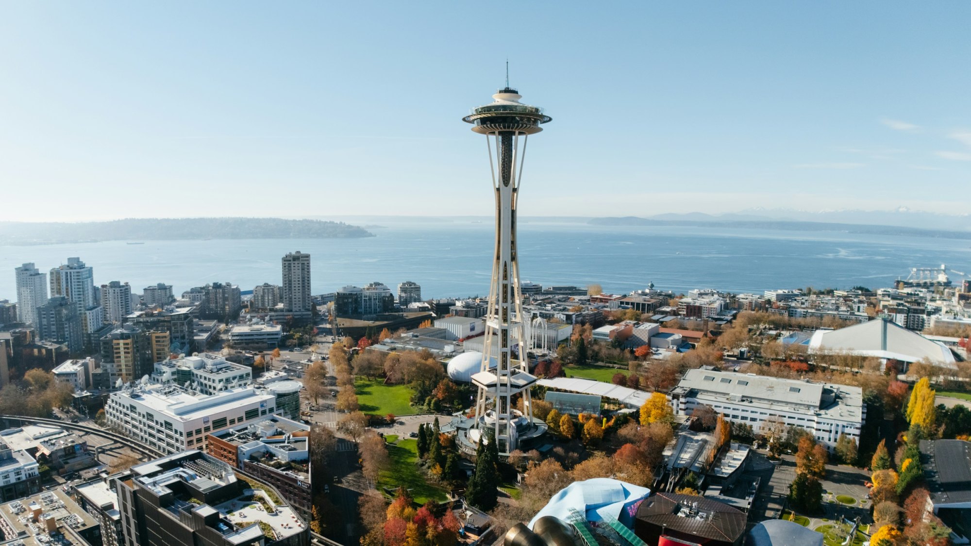 Aerial view of the Space Needle and Seattle Center with Elliott Bay beyond